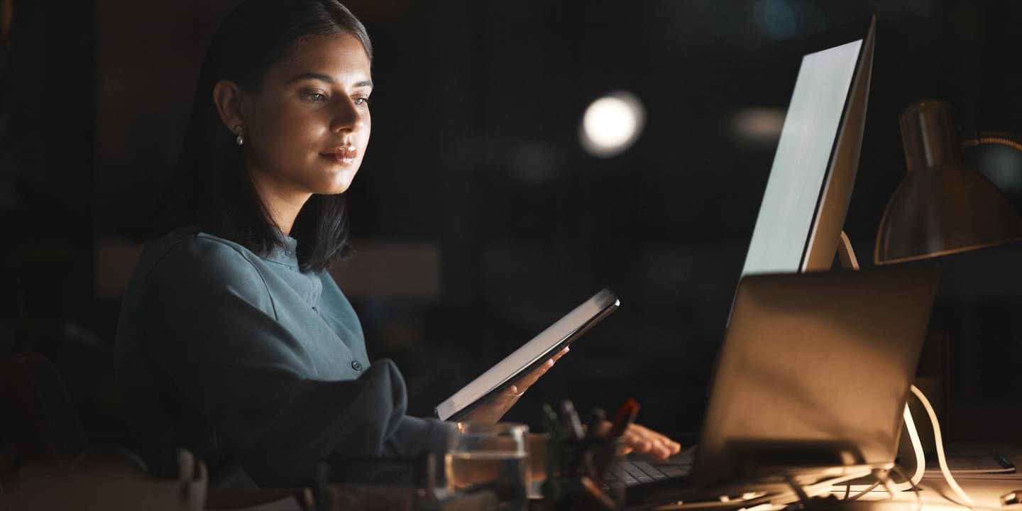 business woman working at night big tech