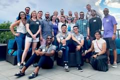 A group photo of various employees at the Propeller Denver office. The group is made up of employees of various ages, races, and genders.