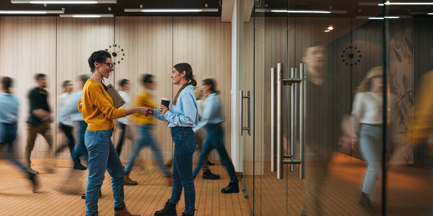 Office Movement Two Female Coworkers Shaking Hands