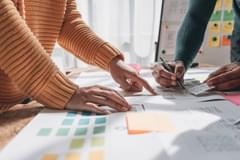 A close-up of a UX team presenting a website layout design