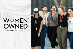 WBENC certification logo with a photo of female Propeller employees smiling with their arms around each other